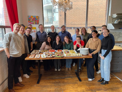 Group shot in front of the food they made