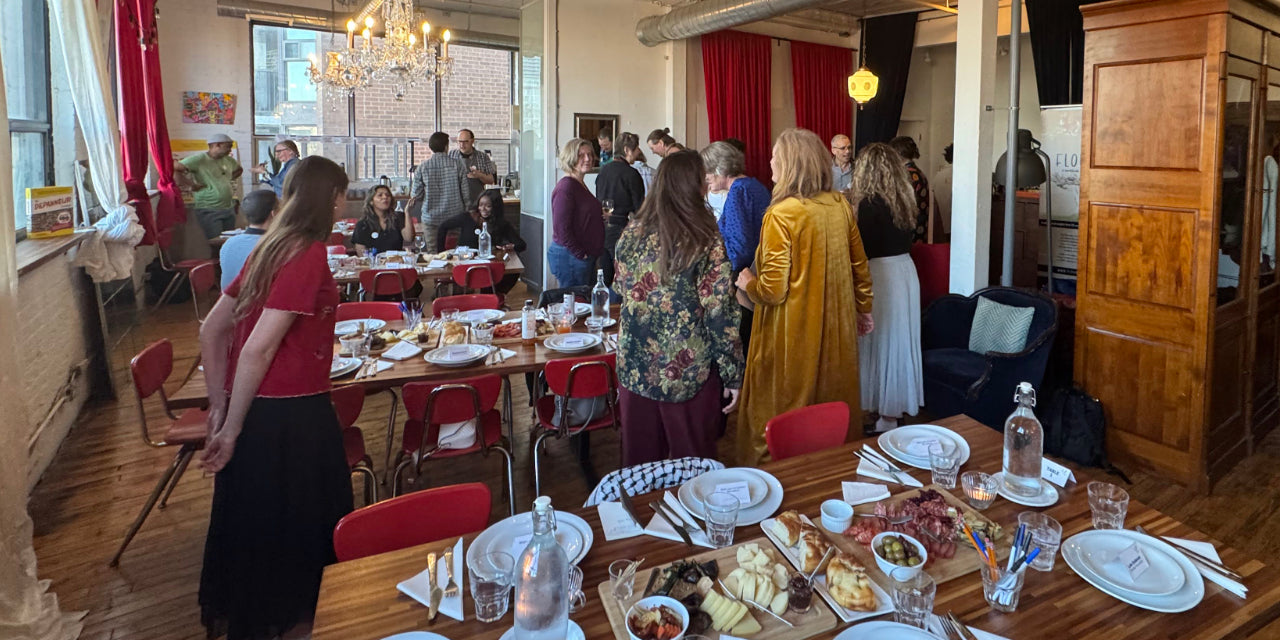 full room mingling around tables